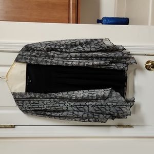 Sara Michelle 2 in 1. Snakeskin print cardigan attached to a black tank.